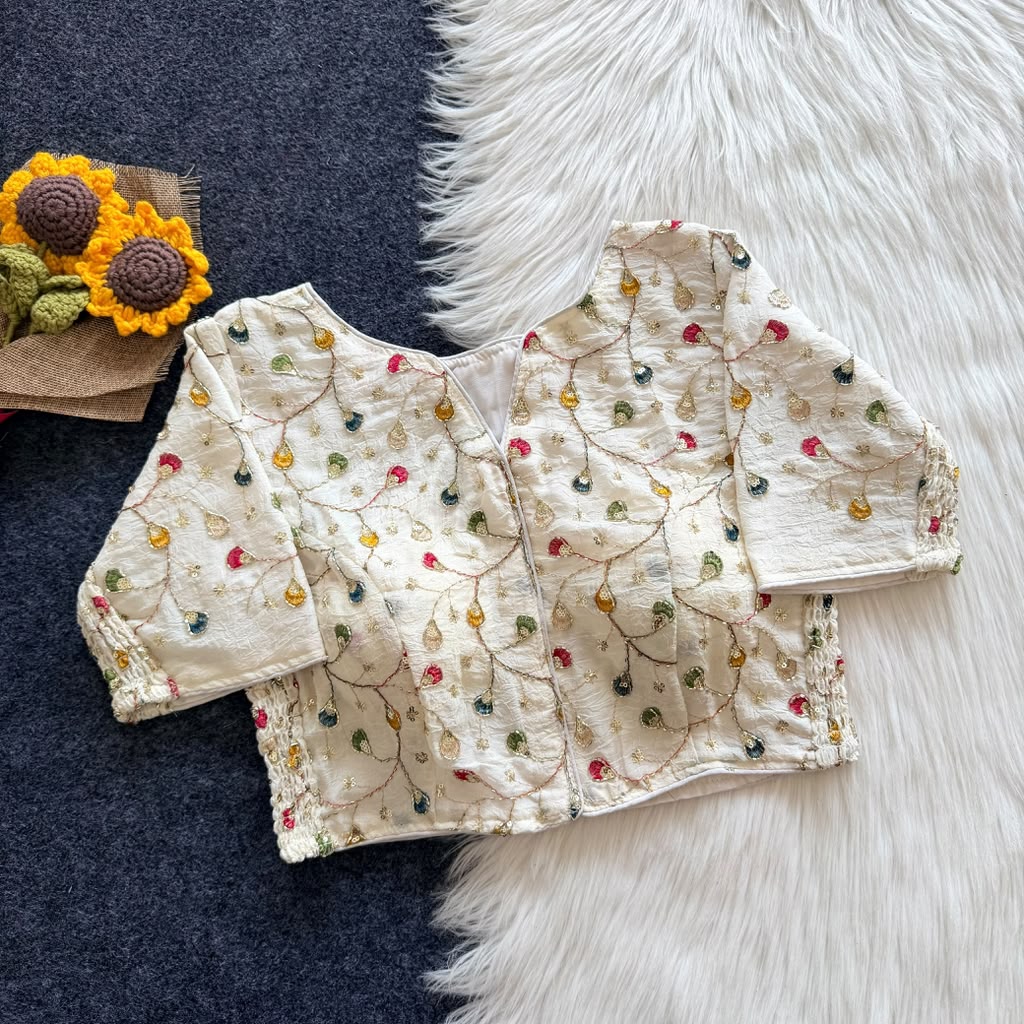 Ivory embroidered crush silk padded blouse