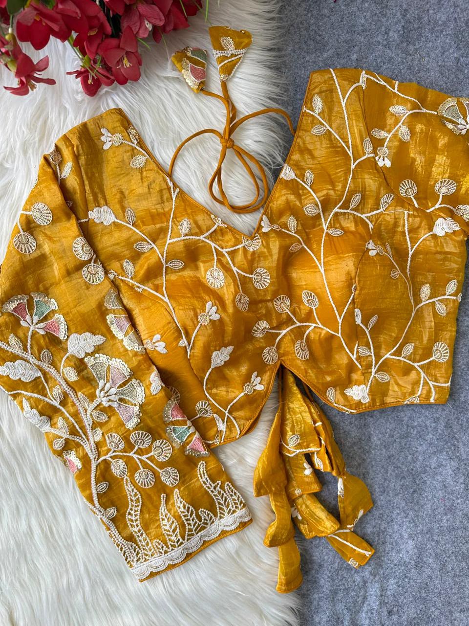 Yellow blouse with floral vine embroidery and decorative tie tassels